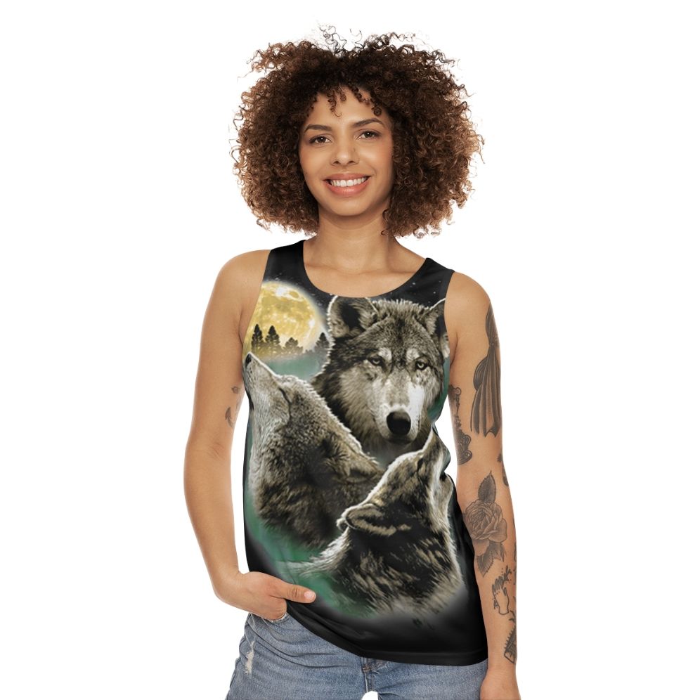 Unisex tank top with three wolves howling at the full moon in the wilderness - women