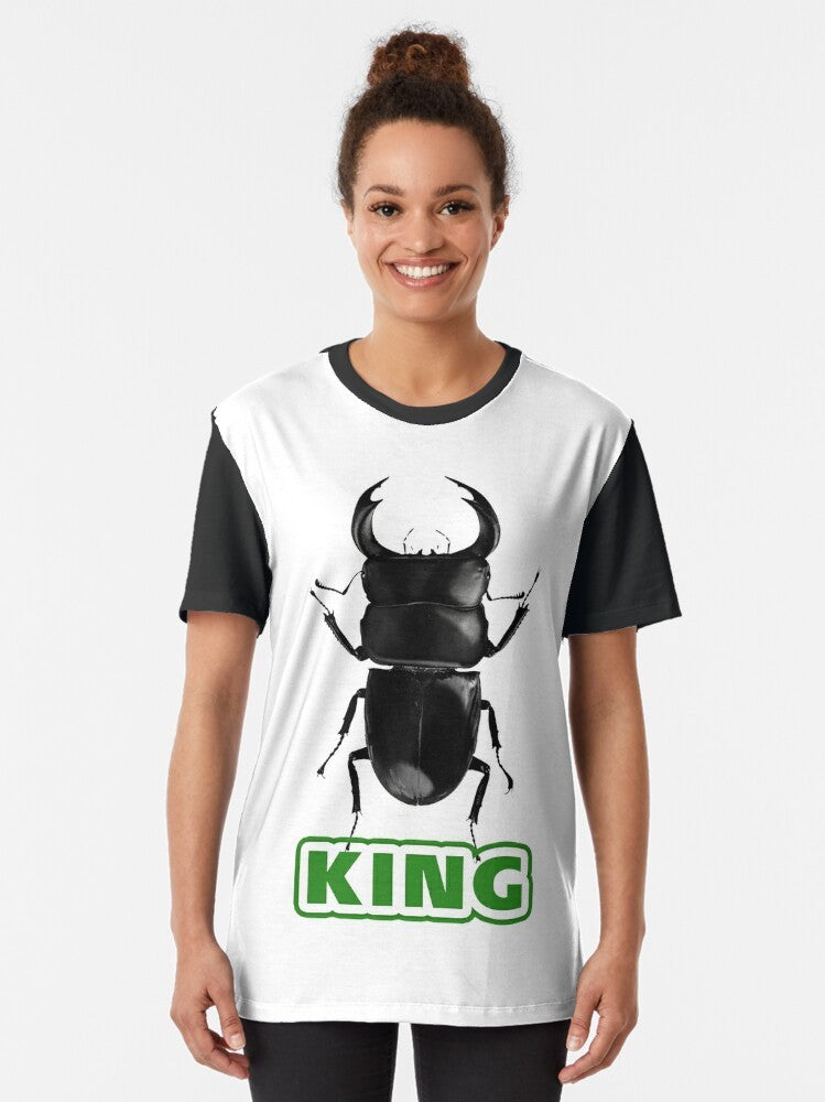 King of Beetles Graphic T-Shirt featuring a stag beetle design in black and glittering details - Women