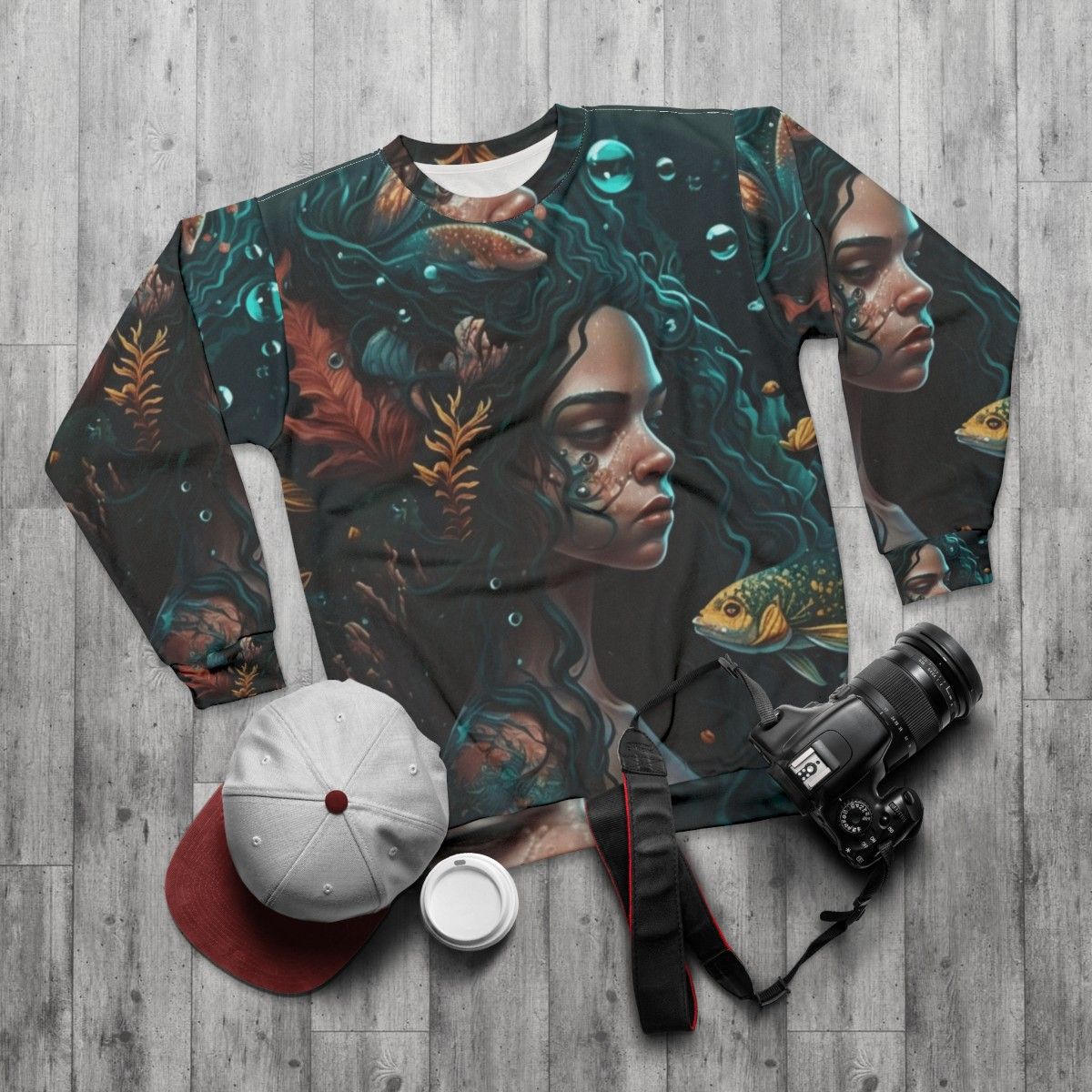 Whimsical sweatshirt featuring mythical sea creatures and fantasy beasts - flat lay