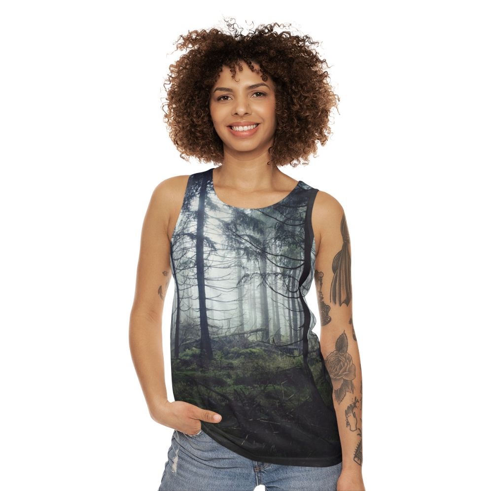 Person wearing unisex nature tank top standing in a forest - women