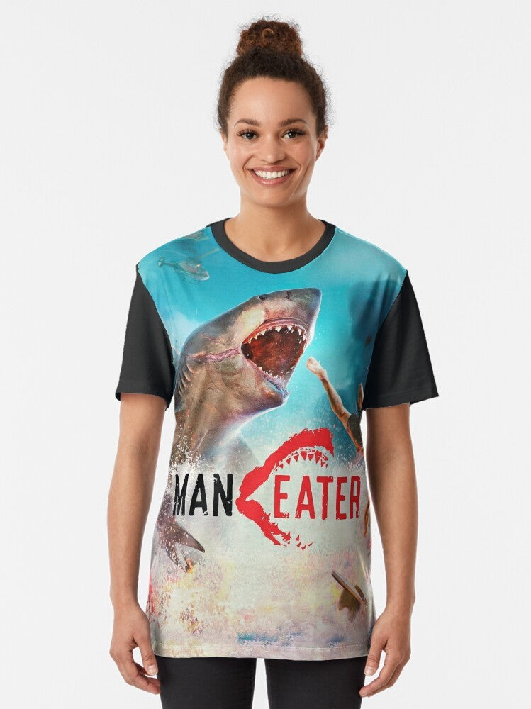 A graphic t-shirt featuring a shark hunting design, perfect for fans of the Maneater game and shark enthusiasts. - Women