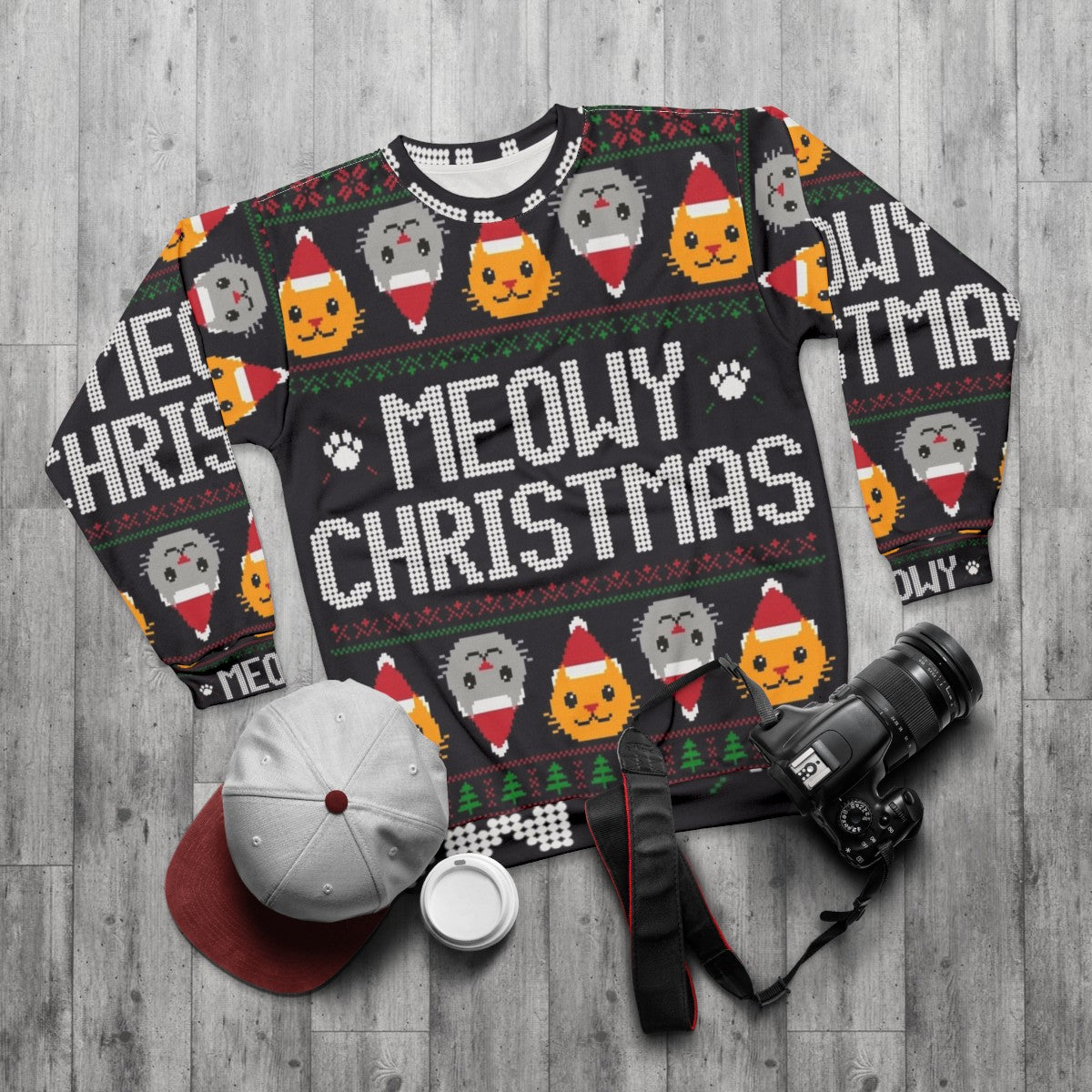 Ugly Christmas sweater cat wearing a festive cat sweatshirt - flat lay