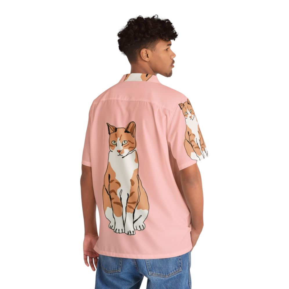 Cat wearing a colorful Hawaiian-style tropical print shirt - People Back