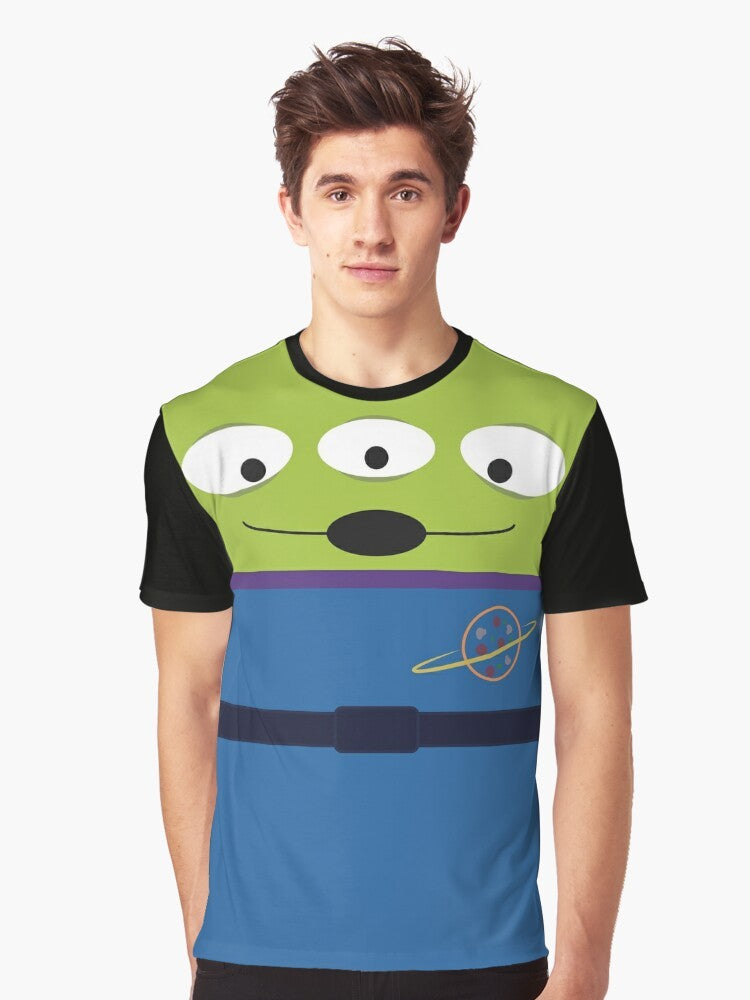 A graphic t-shirt featuring the iconic claw from Toy Story, with text saying "The claw chooses..." - perfect for easy cosplay. - Men