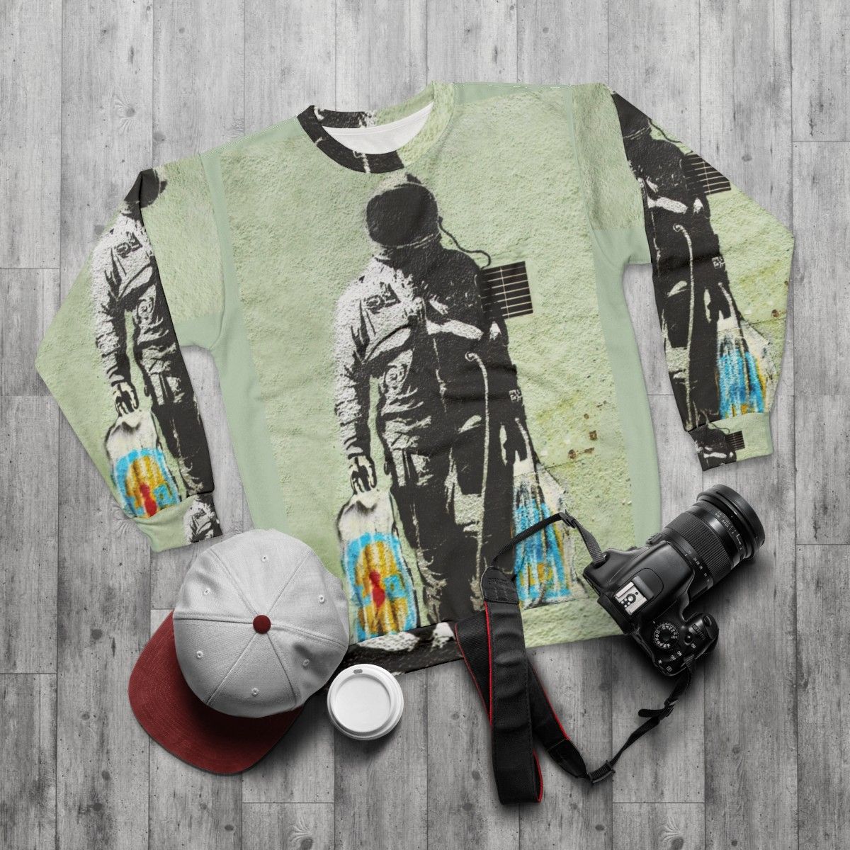 Banksy Astronaut with Shopping Bags Sweatshirt - flat lay