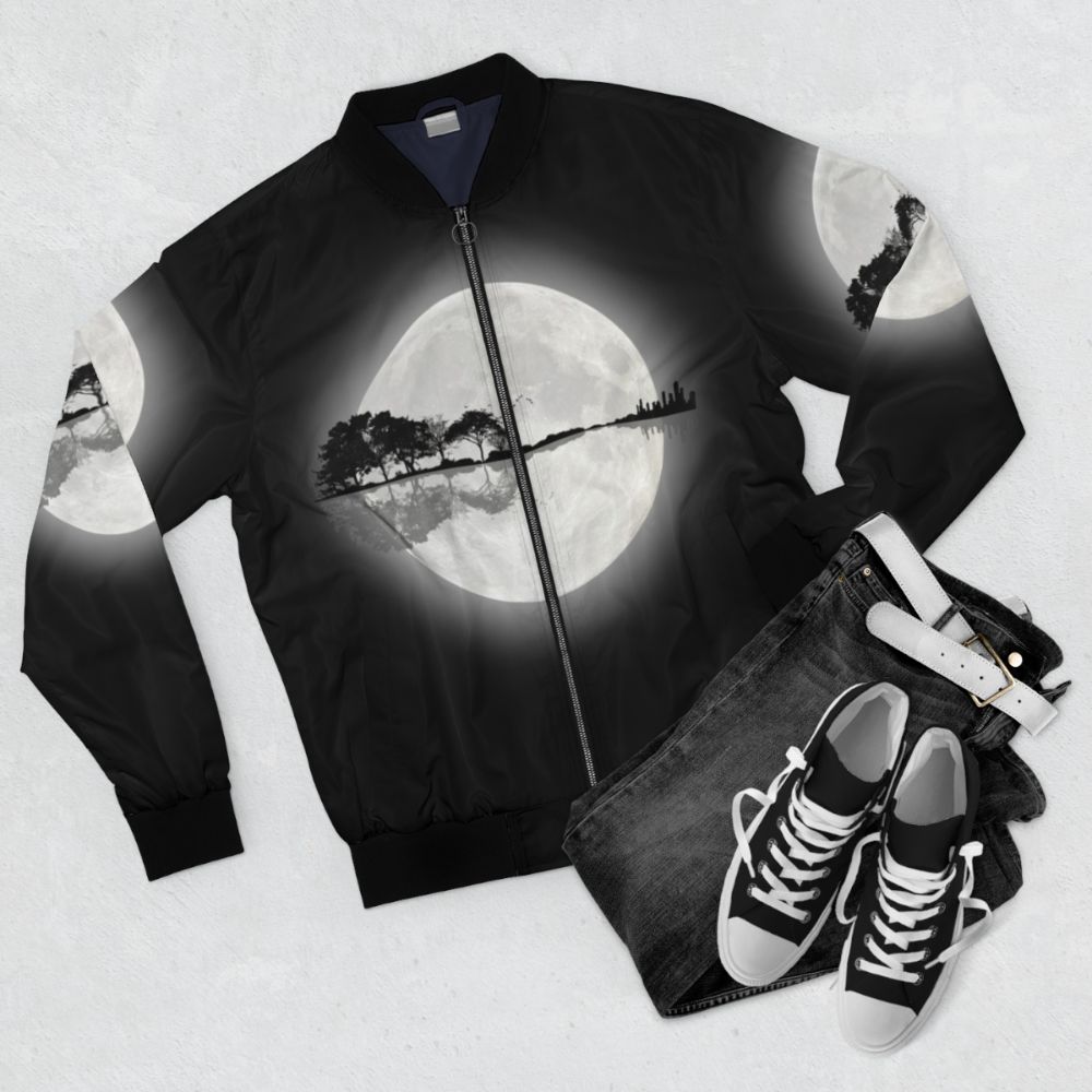 Minimalist bomber jacket with a nature and guitar silhouette design - Flat lay