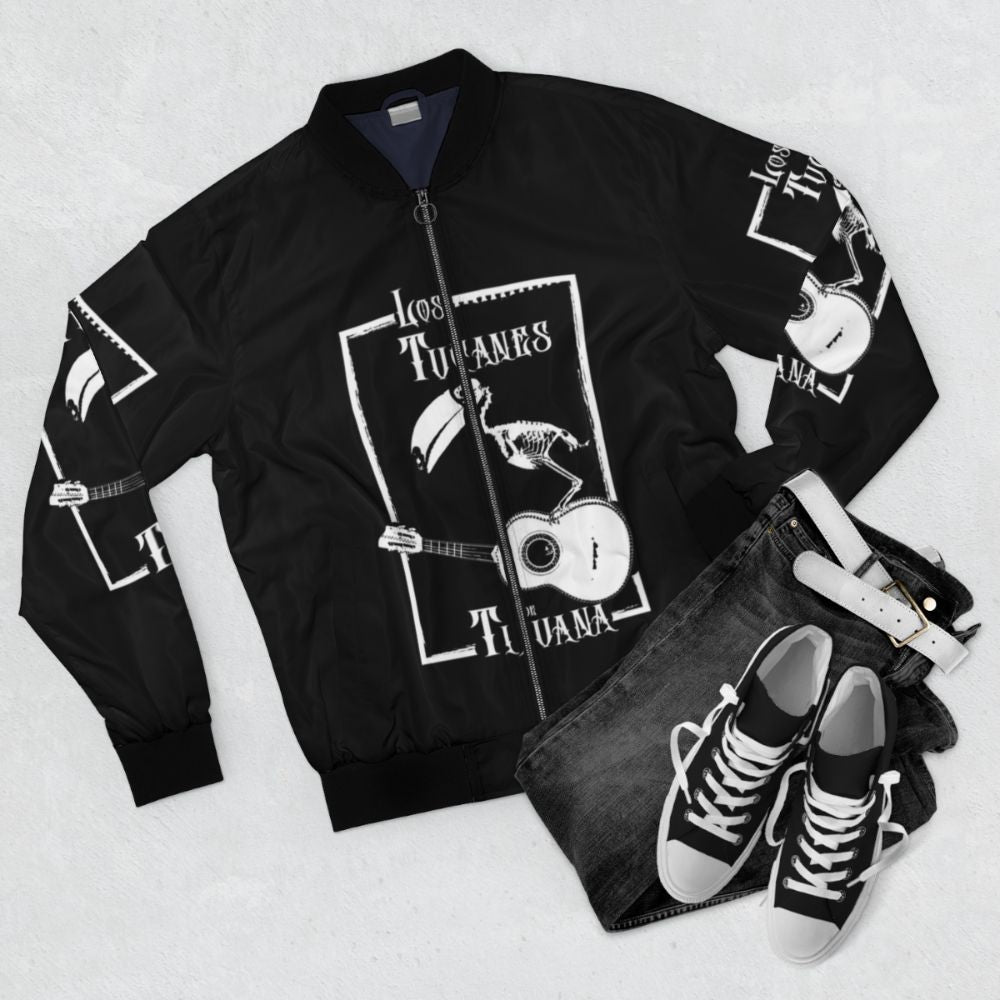 Los Tucanes de Tijuana heavy metal-inspired bomber jacket featuring a skeleton design - Flat lay