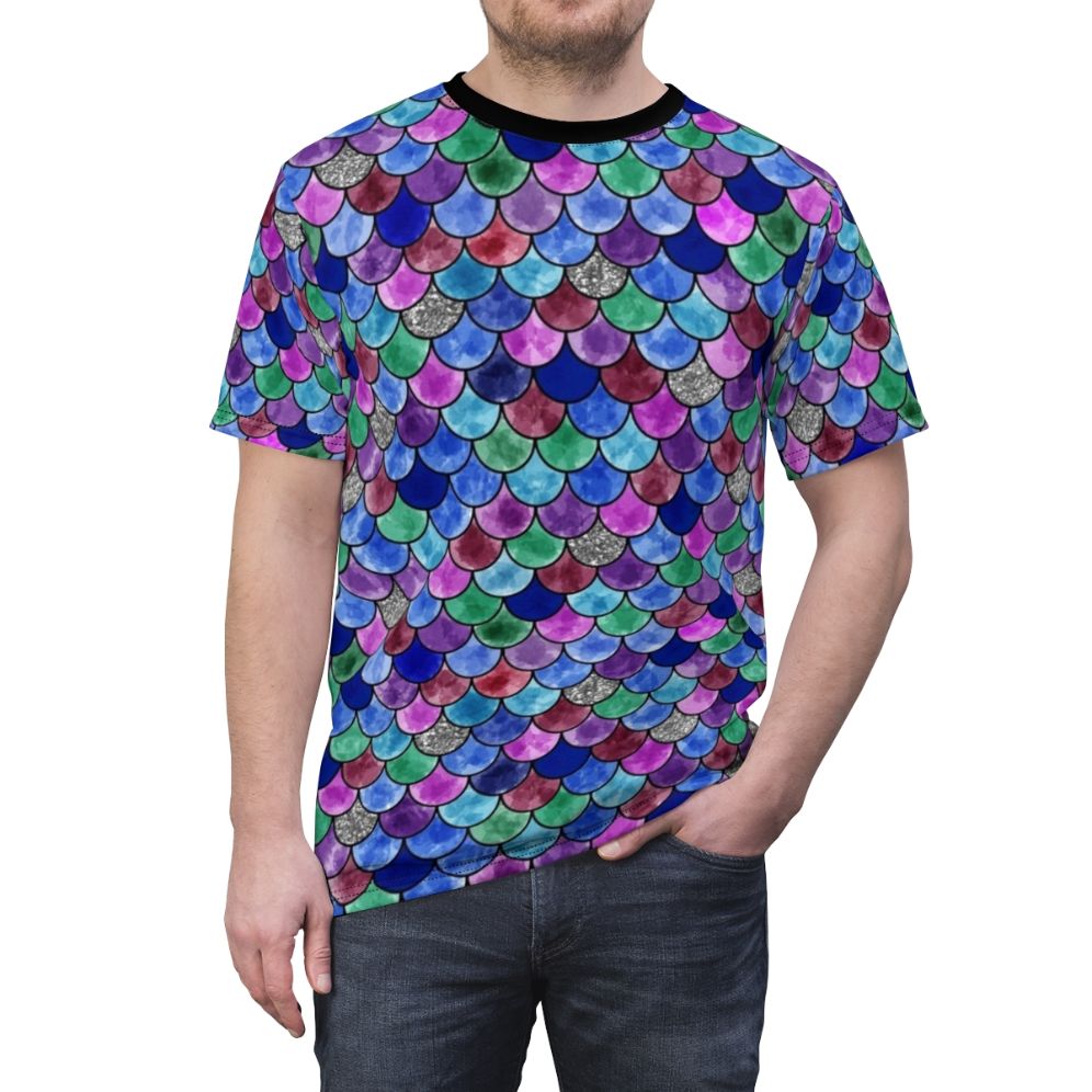 A colorful t-shirt featuring a whimsical watercolor illustration of a rainbow fish with glittery scales. - men front