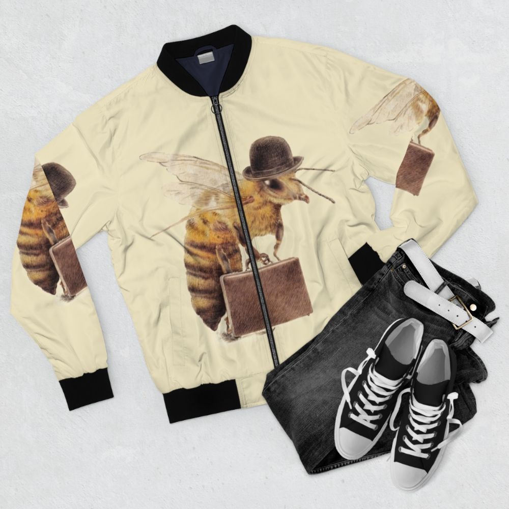 Vintage worker bee bomber jacket with yellow and black color scheme, bowler hat, and surreal design elements. - Flat lay