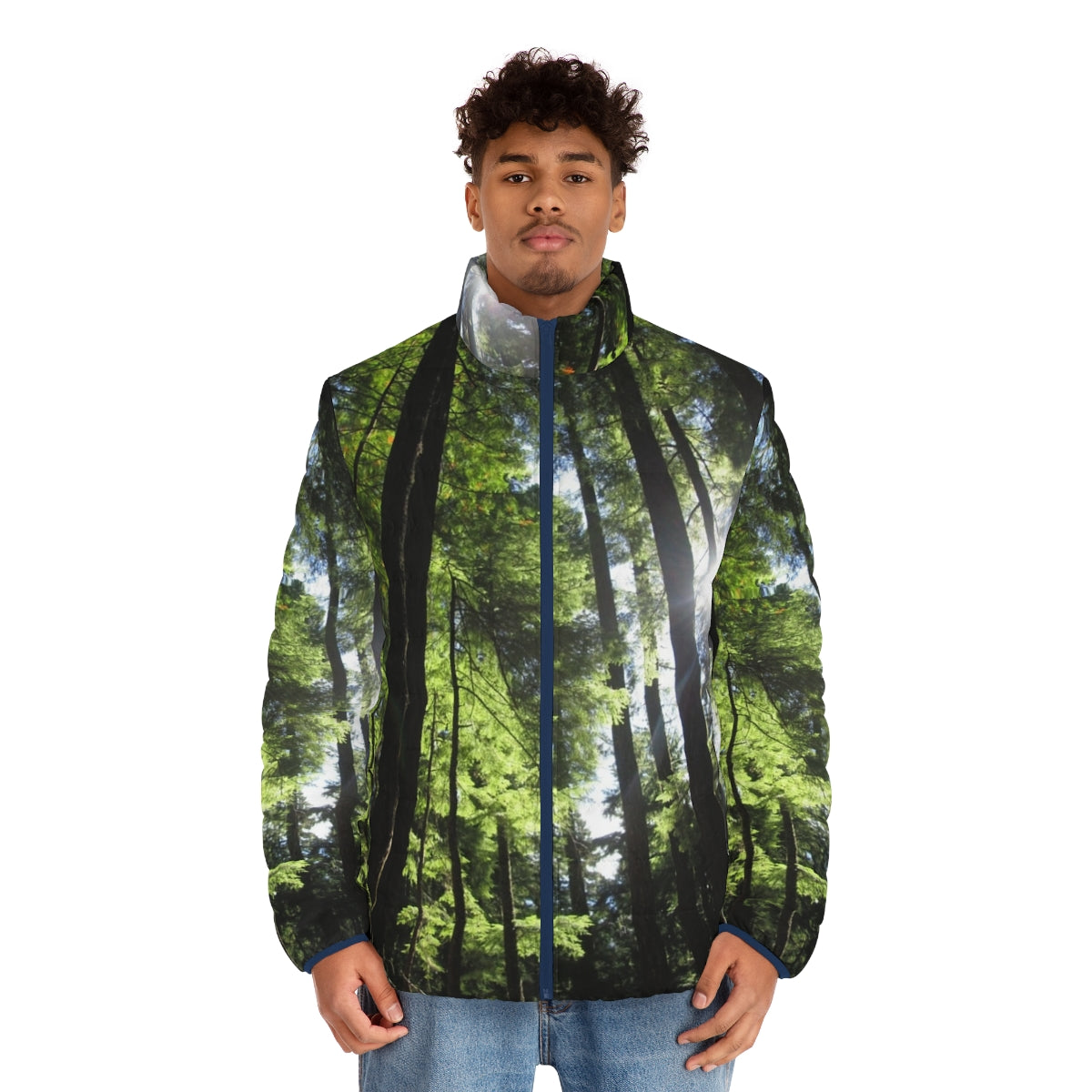 Puffer jacket with a print of sunlit fir trees in a forest - men front