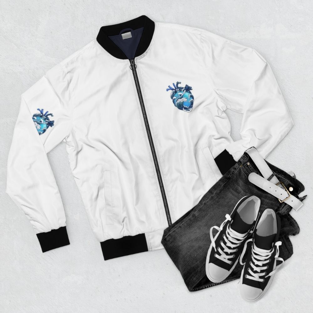 Bomber jacket with a design featuring ocean waves and an anatomical heart - Flat lay