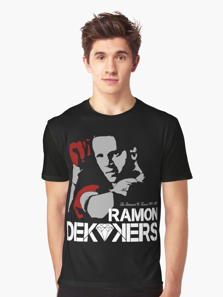 A graphic t-shirt honoring the memory of Ramon Dekkers, the legendary Dutch Muay Thai champion. - Men