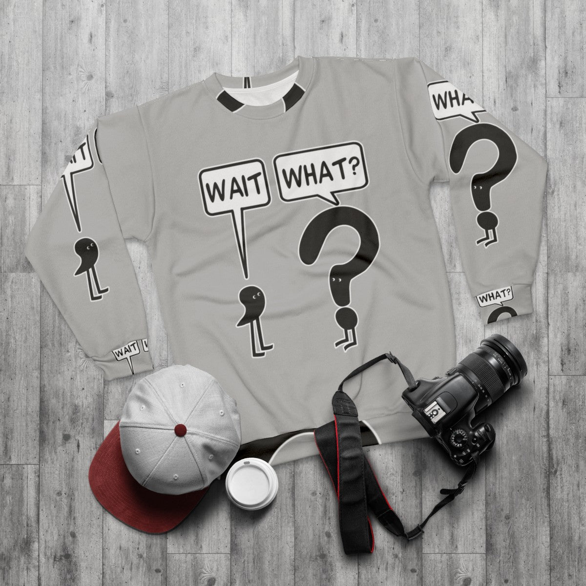 "Wait What" funny sweatshirt with text and illustration - flat lay