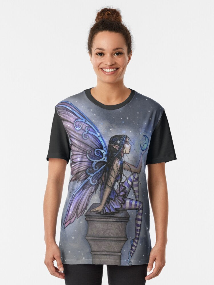 Graphic T-Shirt featuring a fairy design with a blue moon, stars, and celestial elements by artist Molly Harrison - Women