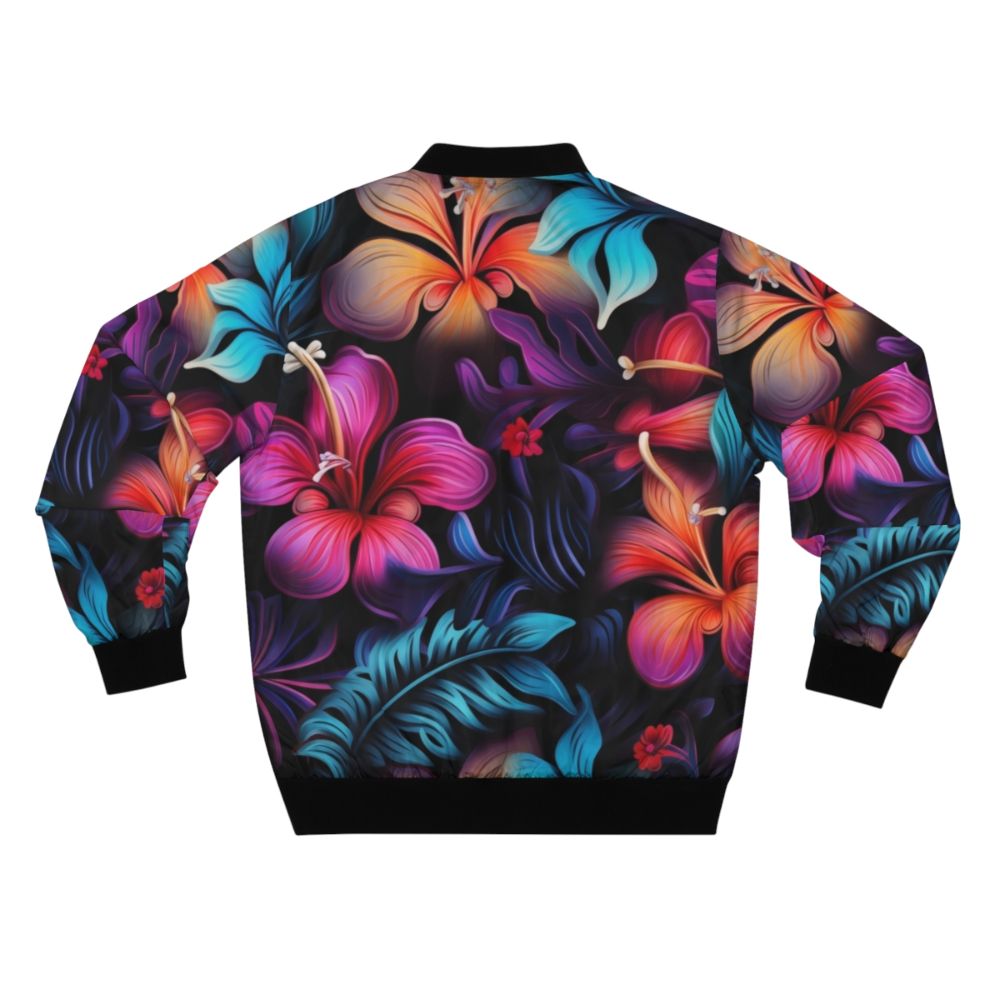 Model wearing a dark Hawaiian pattern bomber jacket with tropical flowers and bioluminescent designs - Back