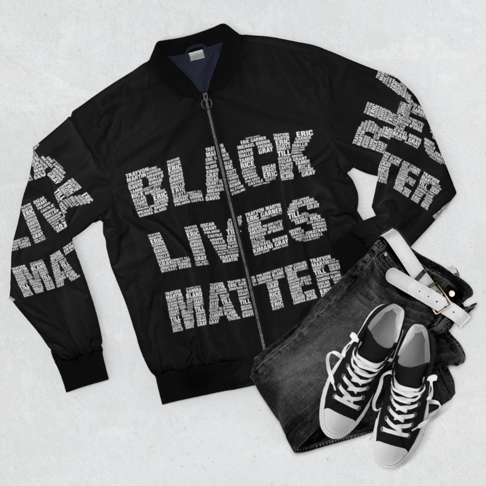 Black Lives Matter Commemorative Bomber Jacket featuring protest and civil rights imagery - Flat lay