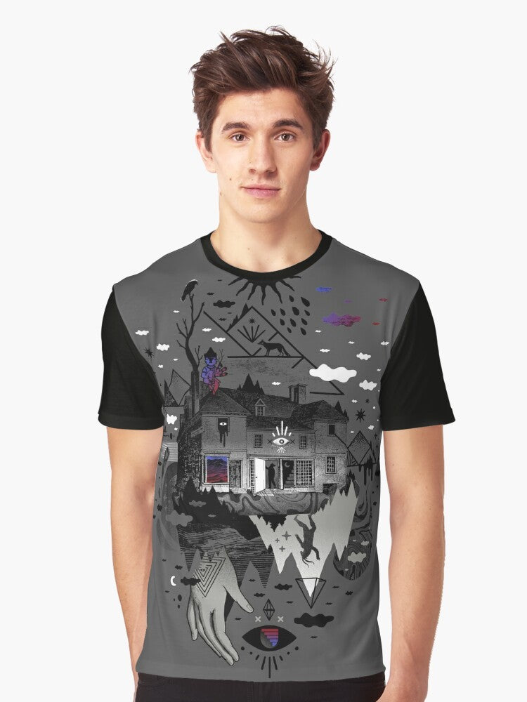 A surreal, abstract graphic tee featuring a collage-style design with a house, mountains, stars, moon, and other mystical elements. - Men