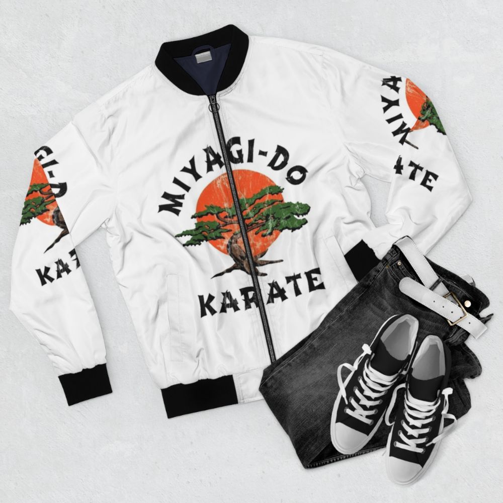 Distressed bomber jacket with karate motifs and vintage design - Flat lay