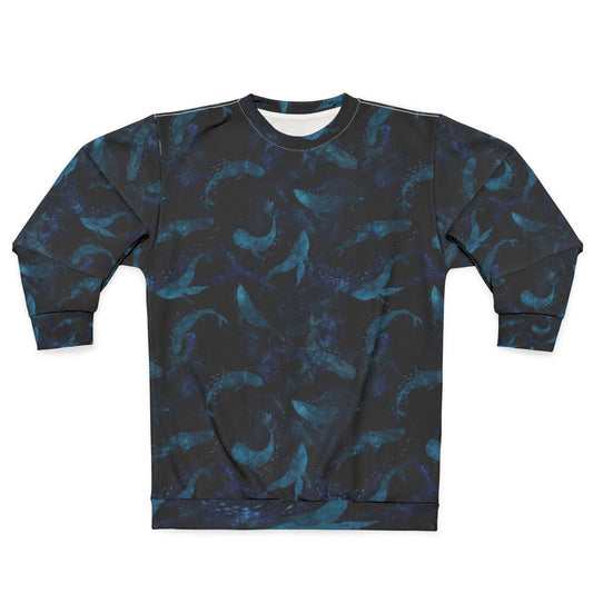 Indigo blue sweatshirt with a design of whales dancing underwater