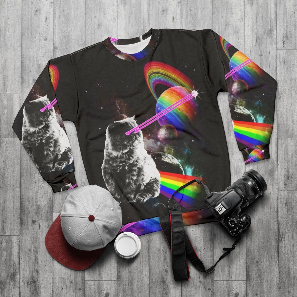 Cosmic cat in a space-themed intergalactic sweatshirt - flat lay