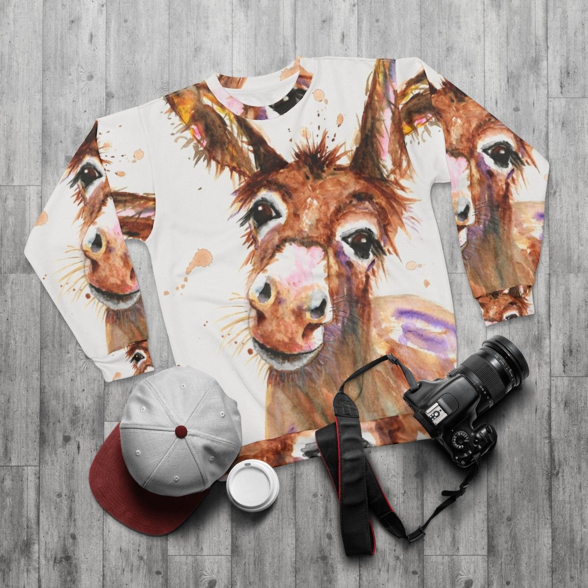 Cute donkey face printed on a cozy sweatshirt - flat lay