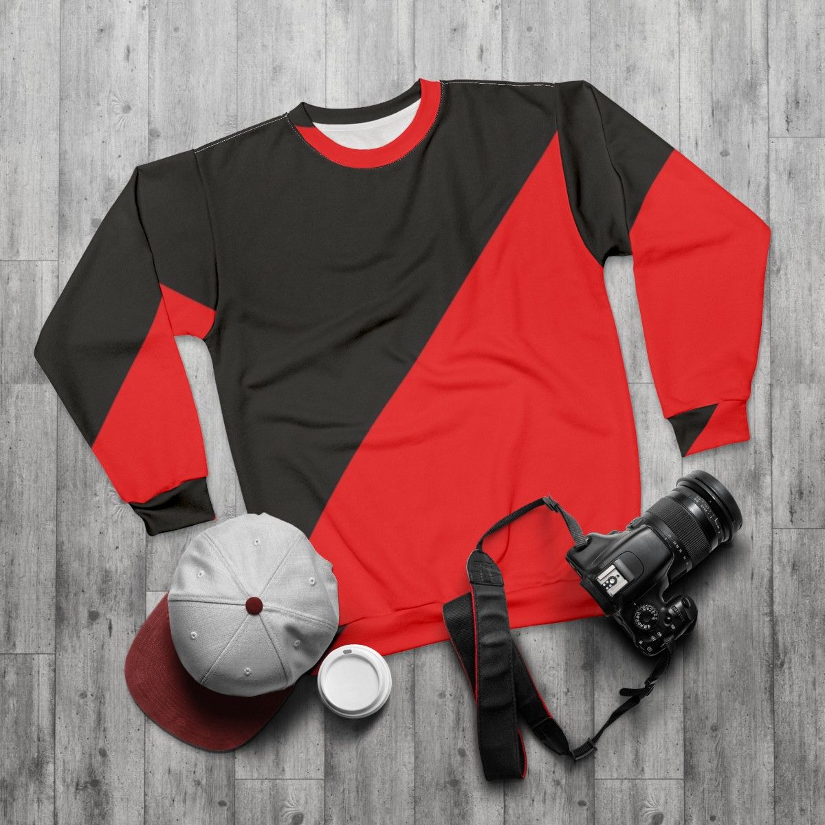 Anarcho communist black and red sweatshirt with radical political design - flat lay