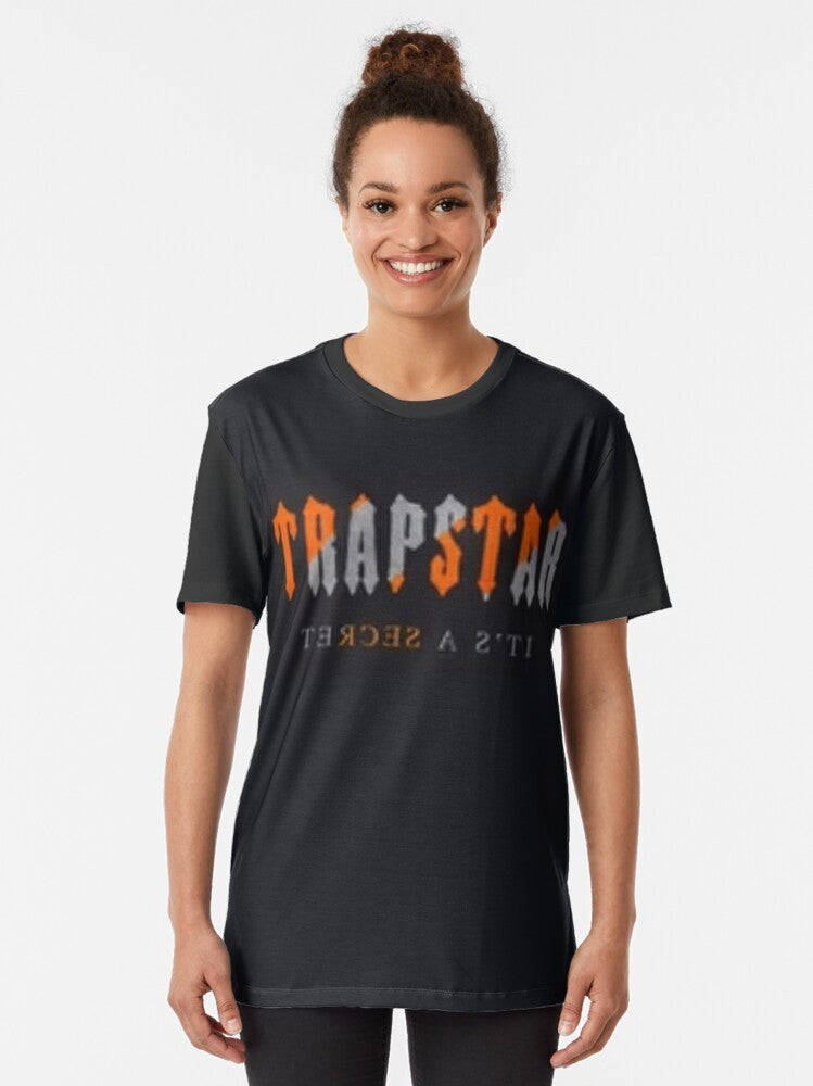 Trapstar Orange Graphic T-Shirt featuring the brand's iconic logo and stripes - Women