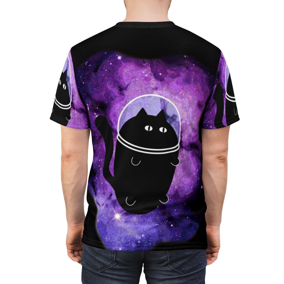 A cat astronaut floating in a galaxy of stars, planets, and nebulae on an all-over print t-shirt - men back