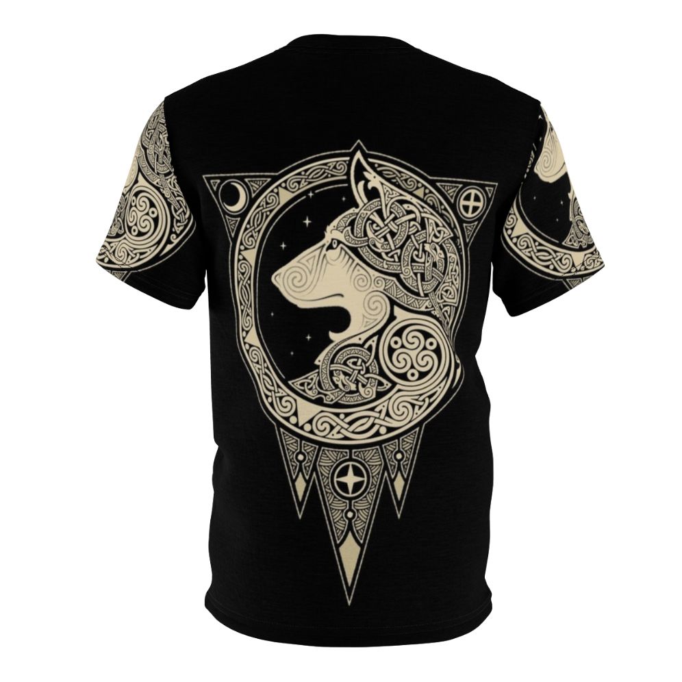 Photograph of a Norse-inspired t-shirt with a detailed wolf graphic, set against a background of celestial symbols and organic patterns. - Back