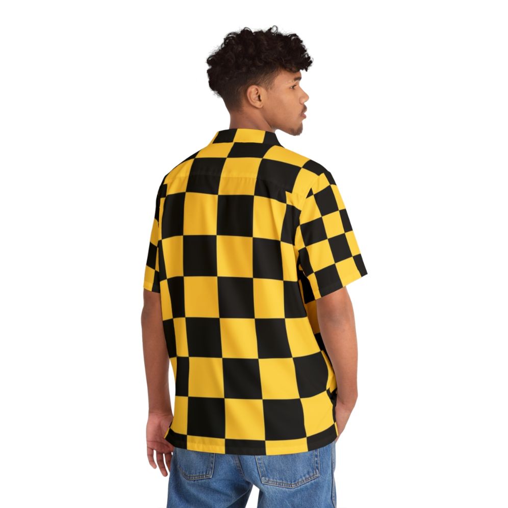 Man wearing a bold black and yellow checkered Hawaiian shirt - People Back