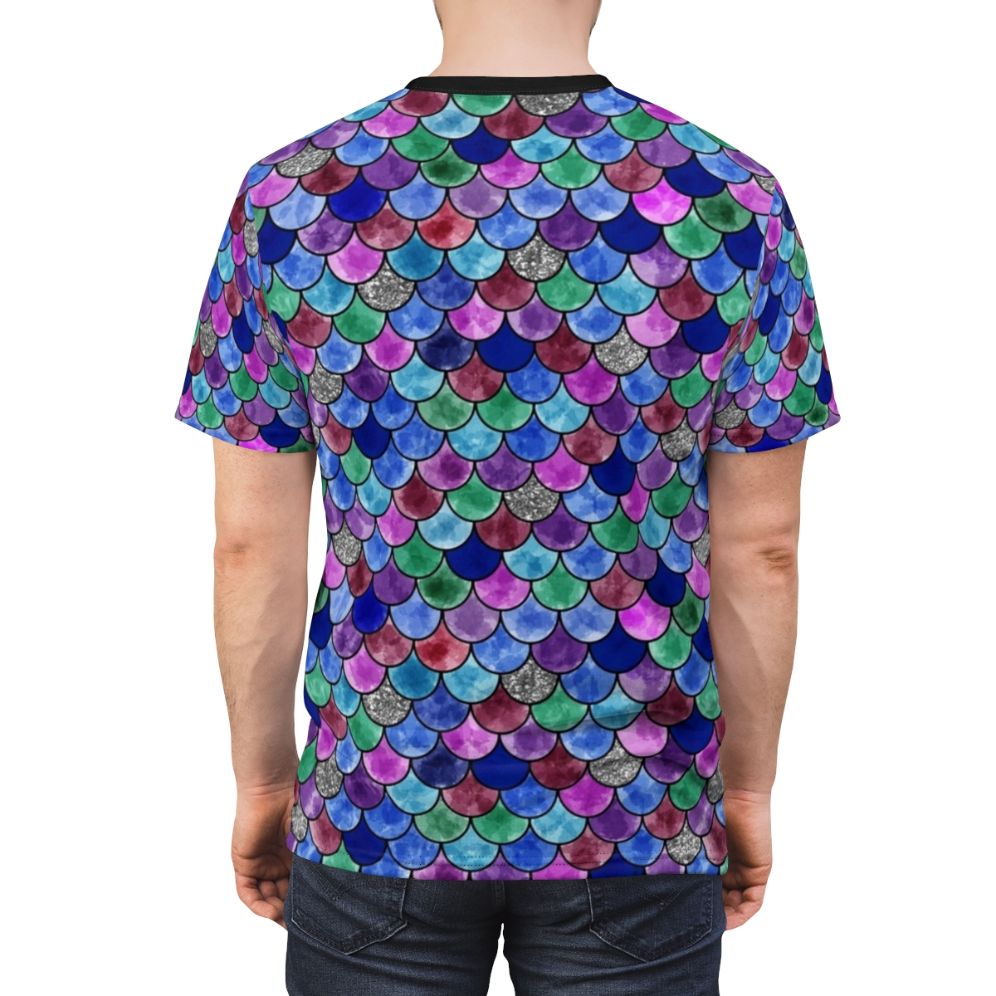 A colorful t-shirt featuring a whimsical watercolor illustration of a rainbow fish with glittery scales. - men back