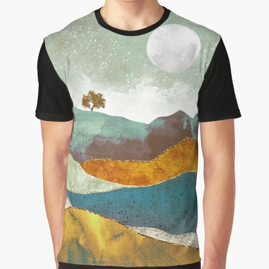 A graphic t-shirt featuring a stunning night fog landscape with a celestial atmosphere of stars, moon, and clouds.