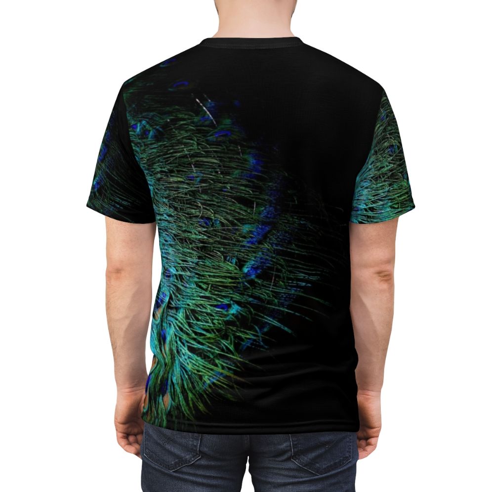 A stylish t-shirt featuring a bold and vibrant peacock feather design against a black background. - men back