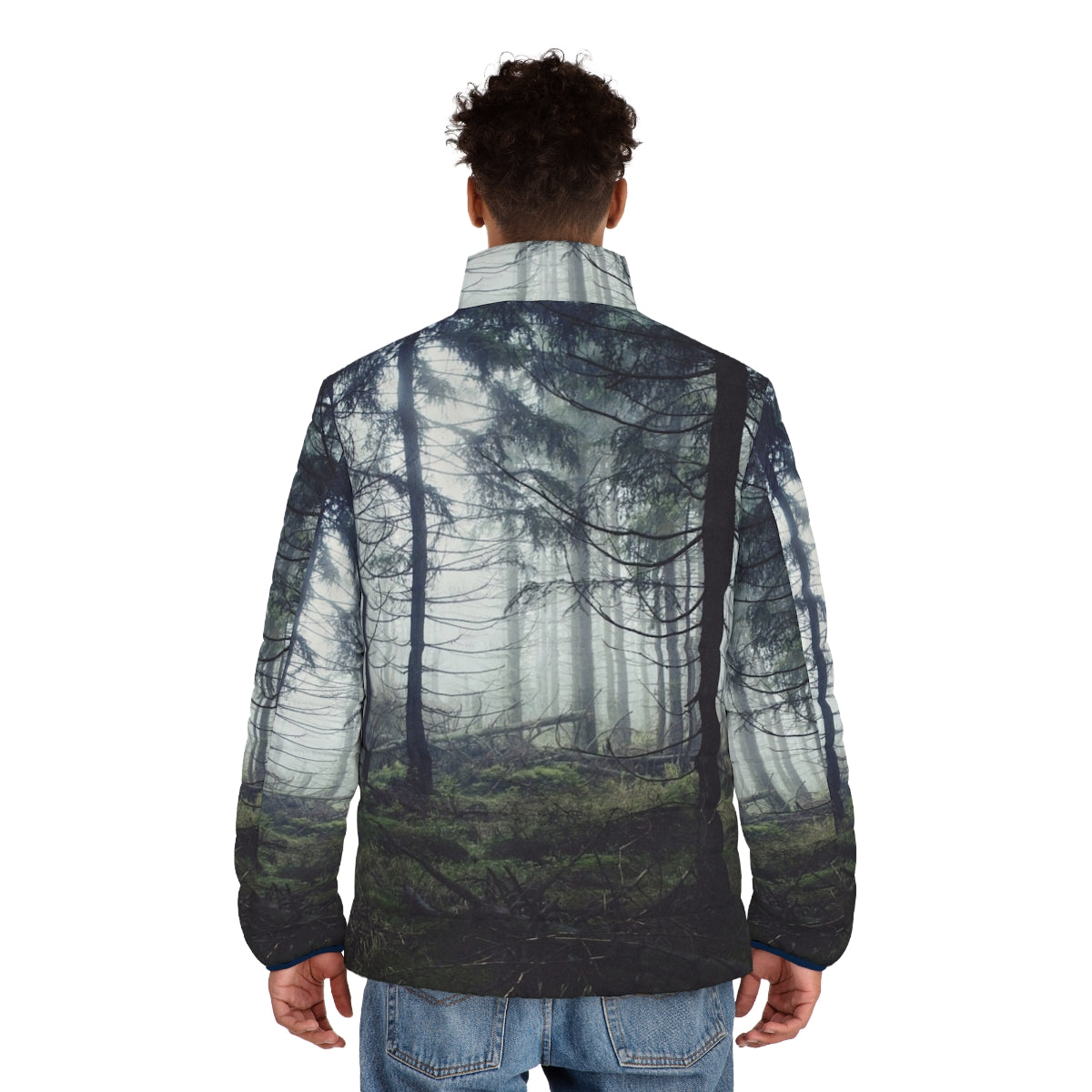 A person wearing a puffer jacket standing in a foggy forest - men back