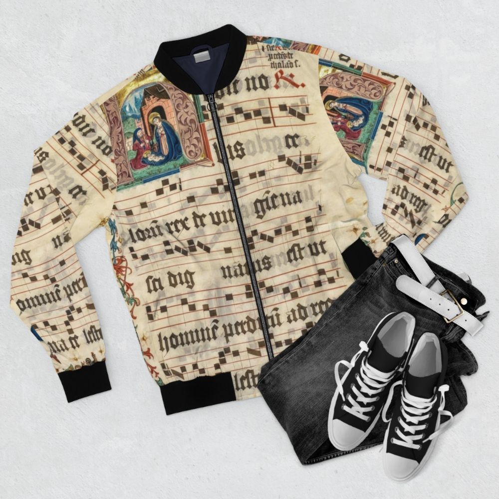 Bomber jacket featuring intricate medieval illuminated manuscript designs and religious imagery - Flat lay