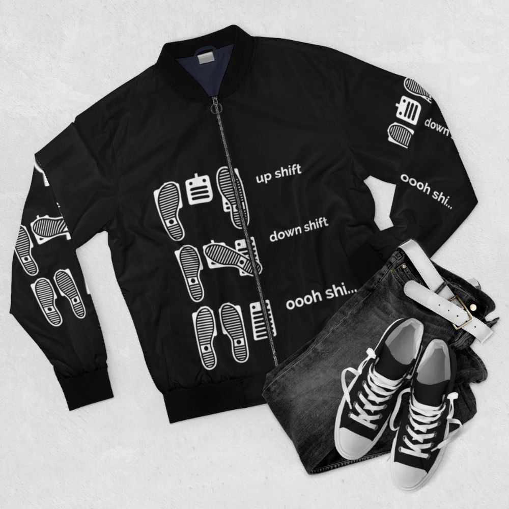 Car enthusiast wearing a bomber jacket with a "Up Shift, Down Shift, Oooh Shi..." design - Flat lay