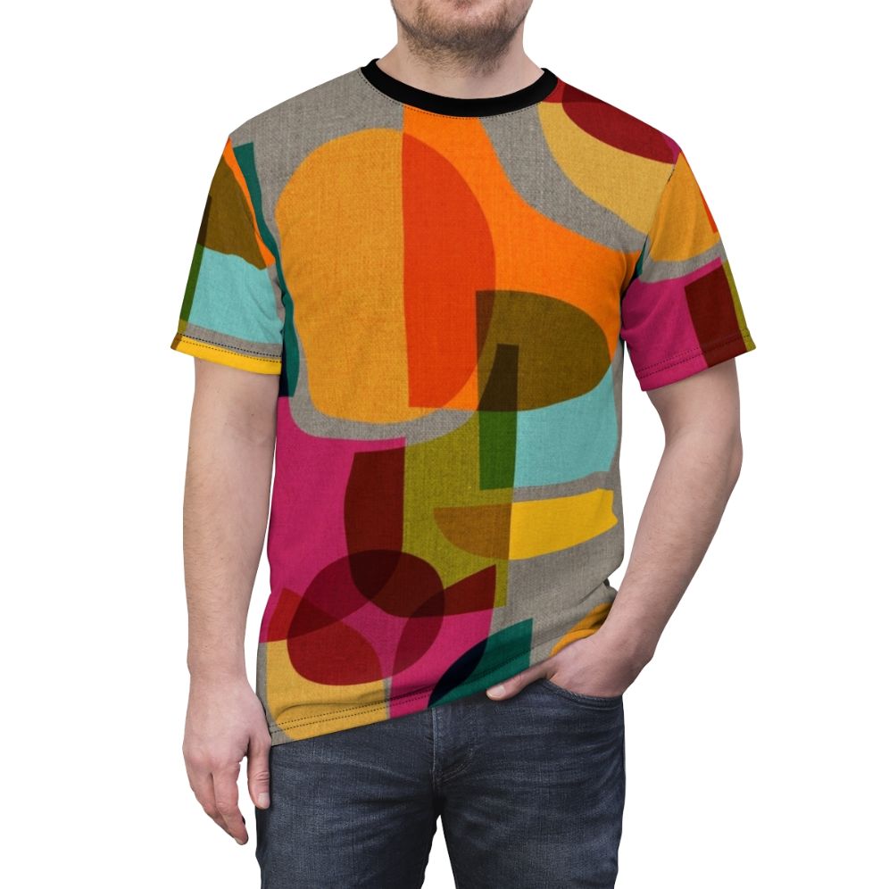 A vibrant mid-century inspired t-shirt featuring a kaleidoscope-like abstract geometric design in a rainbow of colors. - men front