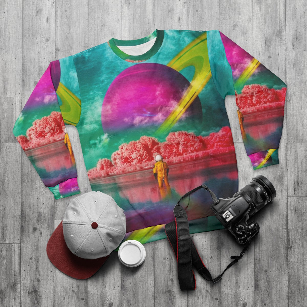 Surreal digital art sweatshirt with river and astronaut design - flat lay