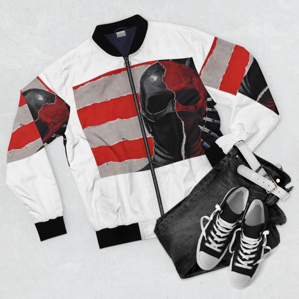 A black graphic bomber jacket with The Boys and Vought International branding. - Flat lay