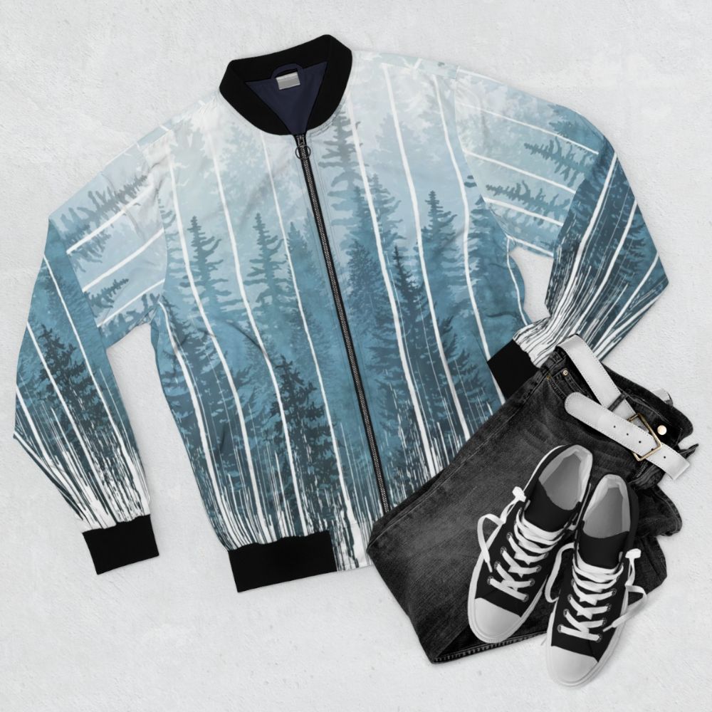 Grunge turquoise bomber jacket with misty forest design - Flat lay