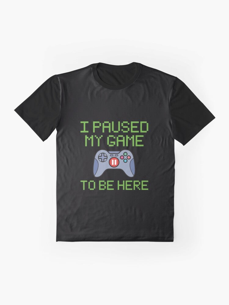 Funny graphic t-shirt for gamers featuring the text "I Paused My Game to Be Here" - Flat lay