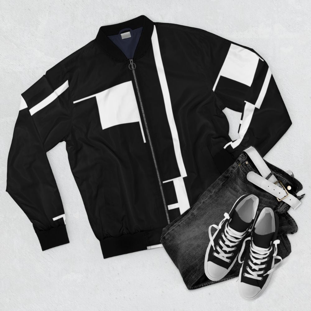 Bauhaus-inspired gothic bomber jacket with black and white geometric patterns - Flat lay