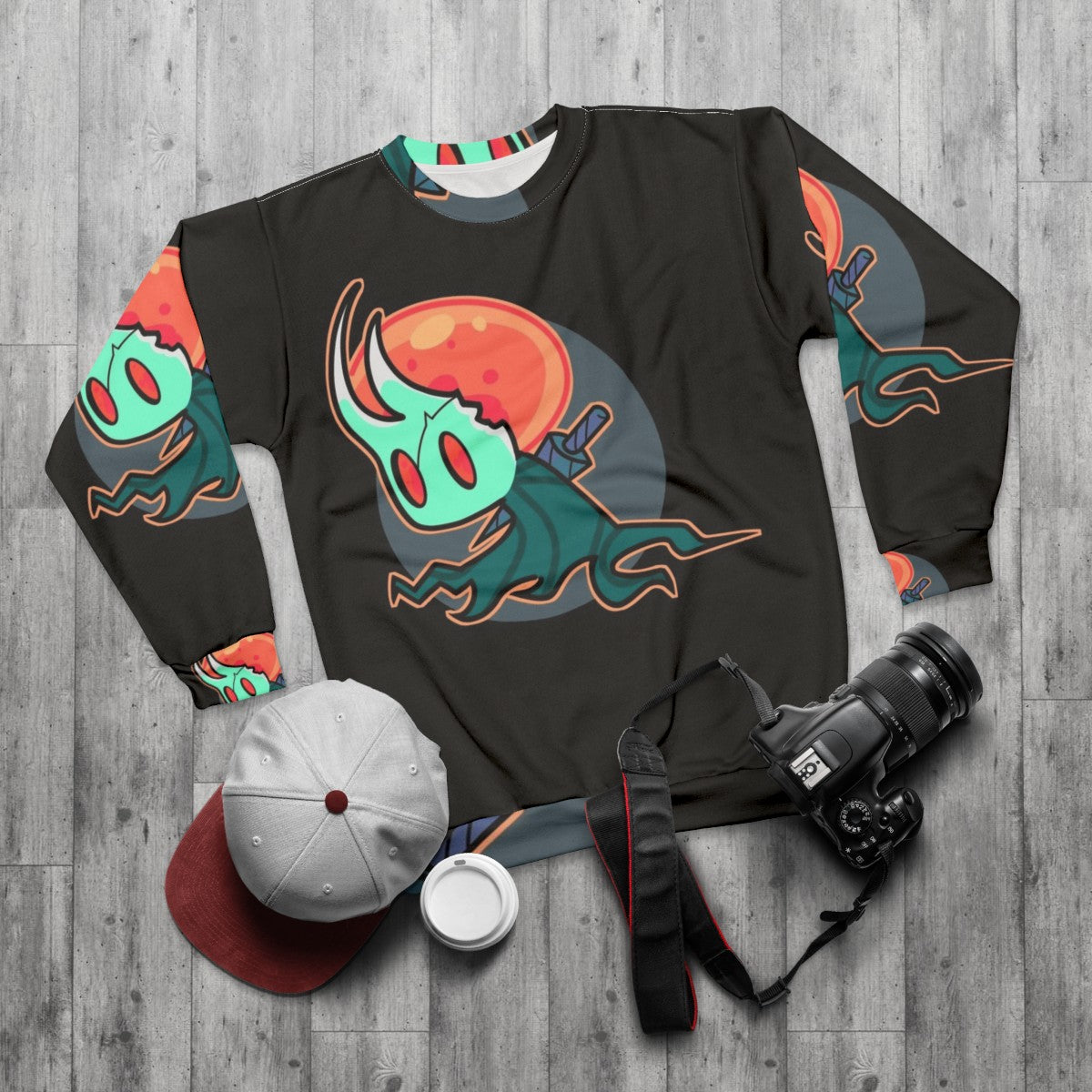 Hollow Knight Sweatshirt featuring the Broken Vessel character - flat lay