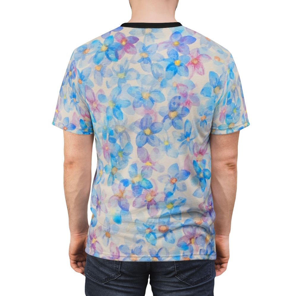 A vibrant blue watercolor painting of flower buds on a t-shirt - men back