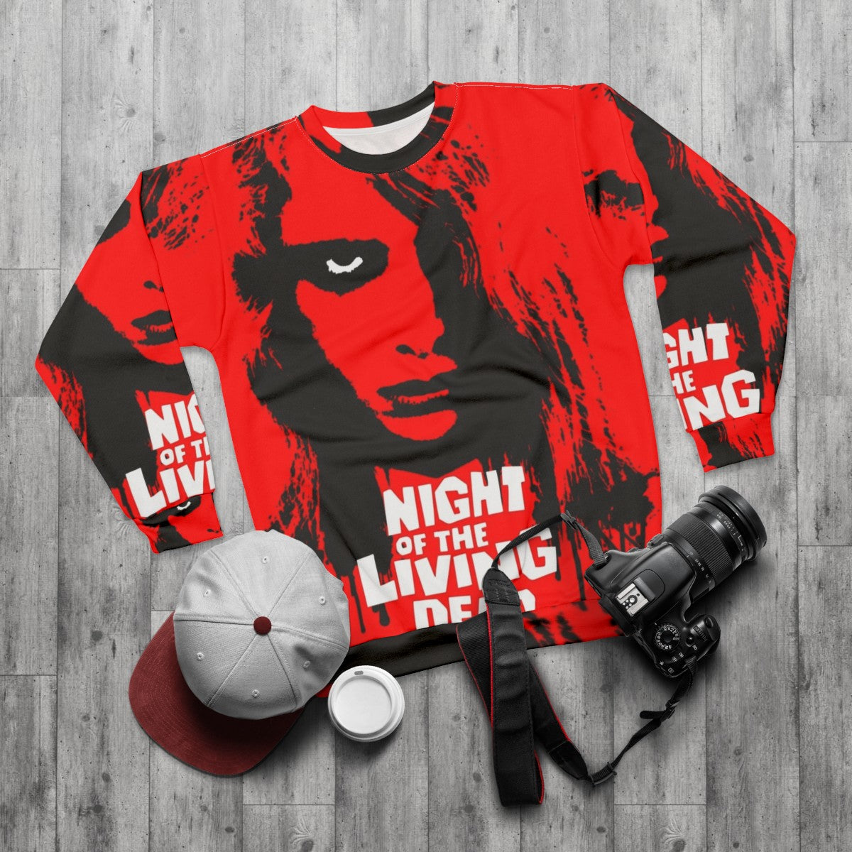 Night of the Living Dead Sweatshirt featuring a zombie graphic - flat lay