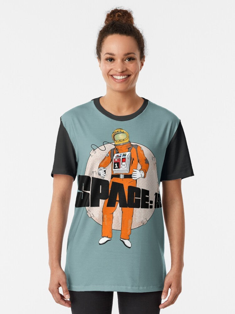 Space 1999 Astronaut Graphic T-Shirt featuring an astronaut in a space suit against a backdrop of planets and the moon - Women