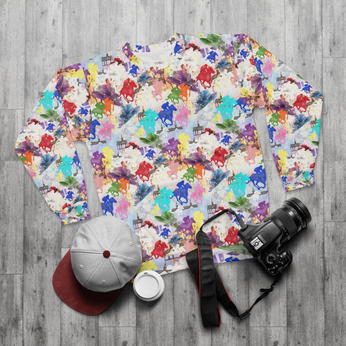 Colorful horse silhouette on a vibrant horse racing sweatshirt - flat lay