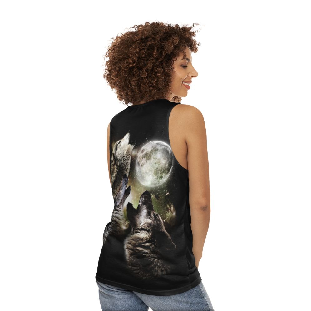 Three wolves howling at the moon on a unisex tank top - women back