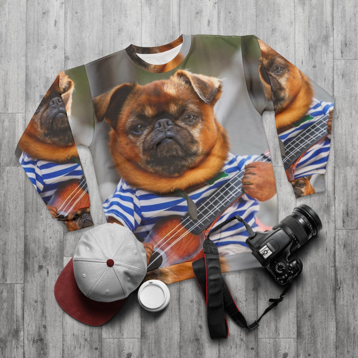 Funny pug dog playing guitar on cozy sweatshirt - flat lay