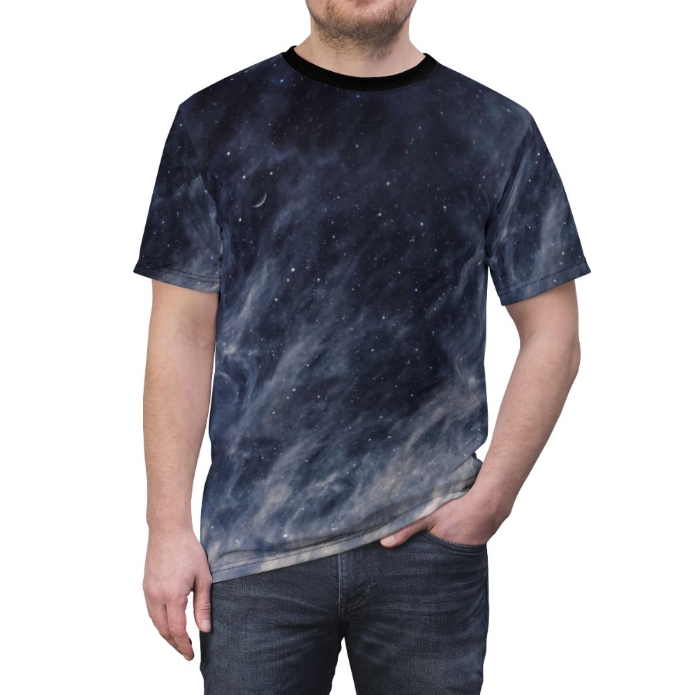 A t-shirt featuring a surreal, moody blue sky with clouds and a crescent moon. - men front